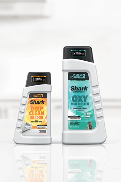 Shark Dual-Fusion Formulas Two formulas combine at the point of contact for 20x more stain-striking power. *vs. Shark® Deep Clean Pro Formula.
